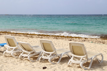 Summer. Beach chairs, chairs on the beach.