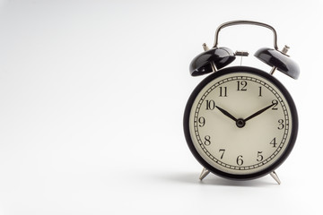 Clock isolated on white background with selective focus and crop fragment