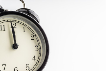 Clock isolated on white background with selective focus and crop fragment