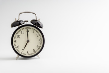 Clock isolated on white background with selective focus and crop fragment