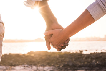 Diversity and no racism concept image with female and male hands taking each other with love and...