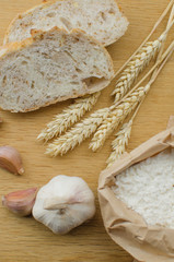 Homemade garlic nut bread on a wooden background