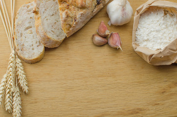 Homemade garlic nut bread on a wooden background
