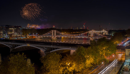 High Resolution Panorama of the Chelsea Bridge in London from Battersea Park at night and the...