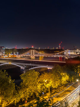 High Resolution Panorama of the Chelsea Bridge in London from Battersea Park at night 