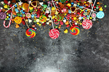 candies with jelly and sugar. colorful array of different childs sweets and treats.