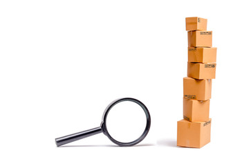 Cardboard boxes and a glass on a white background. The concept of packing goods, sending orders to...