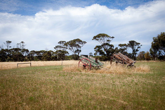 Two vintage wooden carts in the field near traditional australian winery on a lovely sunny day on Kangaroo Island, Australia