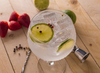 Glass of gin tonic cucumber,lime and ice
