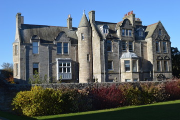 Fototapeta na wymiar University buildings adjacent to St Salvators Quad, St Andrews, Fife, Scotland in November sunshine