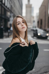 Model looking girl pose on the city street