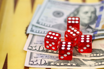 Red cubes lie on dollars.