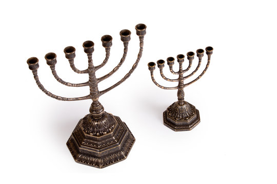 Ritual menorah candlestick on white background