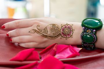 Oriental picture on woman hand