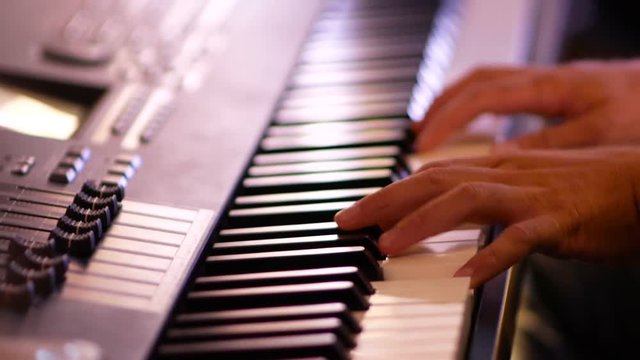 Man playing piano close up