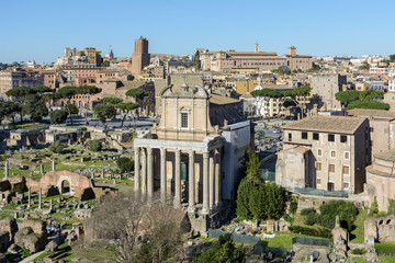 Naklejka premium View of the Roman Forum and the city of Rome from Palatine Hill. The forum with its adjoining buildings is located in the center of ancient Rome. Temples, arches, basilicas and other buildings. 