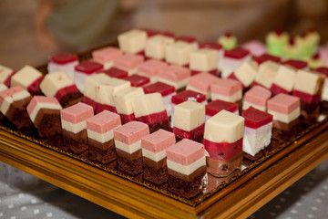 Chocolate and raspberry cake, mousse dessert on a white plate