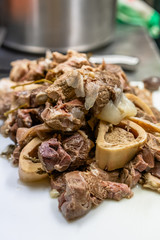 Freshly Boiled Pork on White Cutting Board on Table - Meal Preparation for Wedding