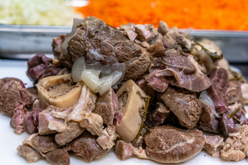 Freshly Boiled Pork on White Cutting Board on Table - Meal Preparation for Wedding