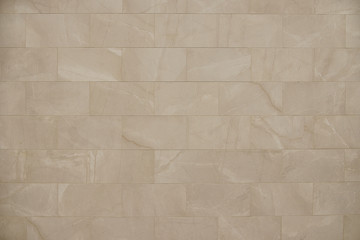 Old beige stone wall background