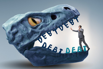 Businessman in the jaws of debt and loan