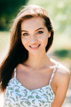 Closeup lifestyle portrait of celebrity female model.  Beautiful girl face on abstract nature background. Cheerful amazing young woman face expression. Sexy blue eyed babe. Glamour youth appearance.