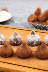 Chocolate truffles made with powdered sugar and cocoa powder.