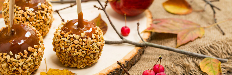 Caramel Apples on Wooden Background. Selective focus.