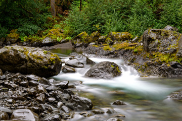 Long Exposure of a lush mountain river at twilight