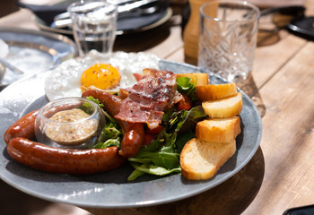 Plate with unhealthy food is on the table