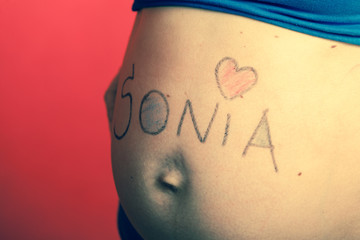 Pregnant woman belly with drawings