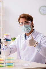 Fototapeta premium Young chemist working in the lab 