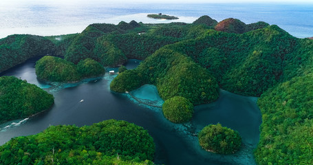 Aerial view of Sugba lagoon. Beautiful landscape with blue sea lagoon, National Park, Siargao Island, Philippines