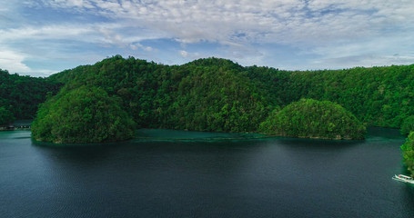 Fototapeta na wymiar Aerial view of Sugba lagoon. Beautiful landscape with blue sea lagoon, National Park, Siargao Island, Philippines