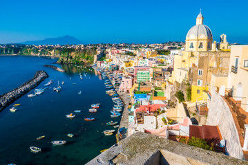 Perfect tiny seaside village with multi colored houses of Marina di Corricella, Procida Island, Naples Italy - obrazy, fototapety, plakaty