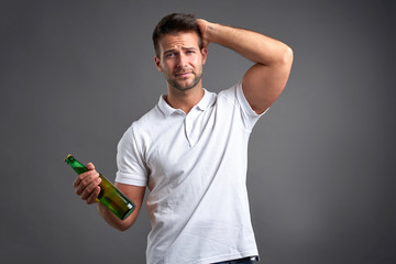 Young man with a beer