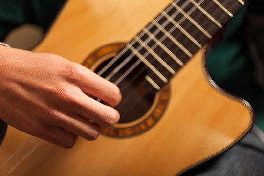 Detail of a classical guitar player