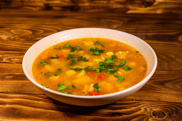 Georgian traditional food soup kharcho on wooden table
