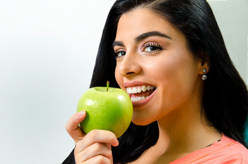 Closeup pretty natural woman preparing to bite an apple 