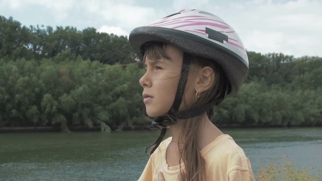 Asthma. The child is suffocating in nature. Little girl with inhaler on nature.