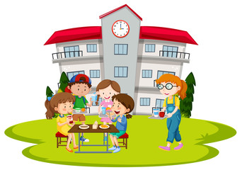 Obraz na płótnie Canvas Children having lunch at school