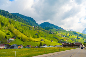 Obraz premium Countryside road in village, Alt Sankt Johann, Sankt Gallen, Switzerland