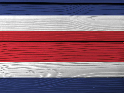 Flag of Costa Rica on wooden wall background. Grunge Costa Rica flag texture, blue red and white color.