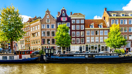 The Prinsengracht (Prince Canal) at the Leliegracht (Lelie Canal) with its many historic houses and ornate gables in the center of Amsterdam