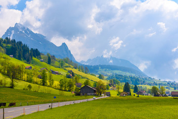 Fototapeta premium Countryside road in village, Alt Sankt Johann, Sankt Gallen, Switzerland