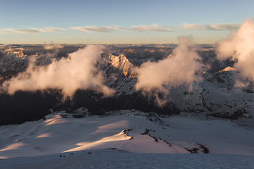 Panoramic view of high mountain peaks in beautiful morning light. Hiking and climbing in Elbrus region