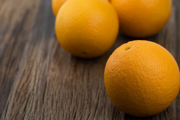 Mandarin oranges on the wooden floor.