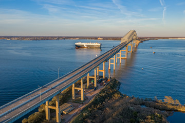 Aerial view of Francis Scott Key Bay bridge over the Patapsco river in Baltimore Maryland with ships