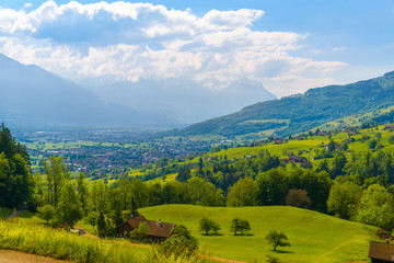 Naklejka premium Wooden cottage houses in mountain village, Grabs, Werdenberg, St