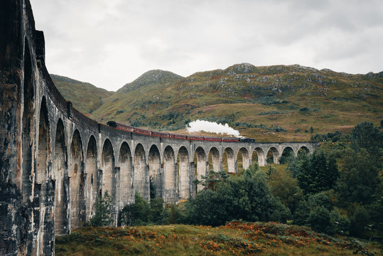 Steam train over Glenfinnan viaduct in the Highlands, Scotland